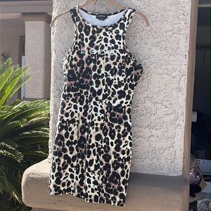 Bebe mini dress with rhinestones, nylon and Spandex. Excellent condition. Size M